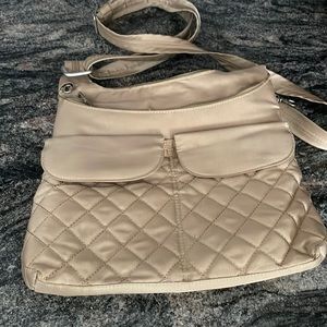 Travelon anti theft bag . Beige color. 12 by 14 inches.